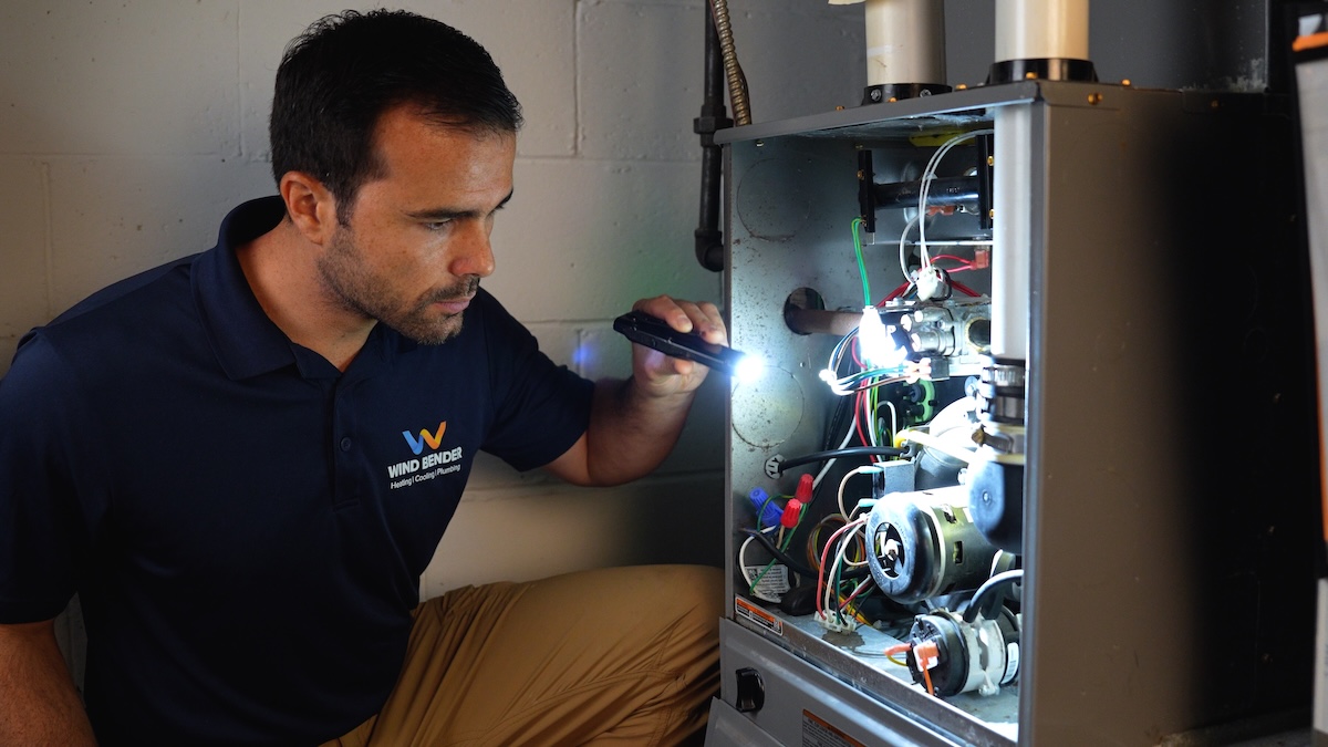 Wind Bender worker fixing furnace